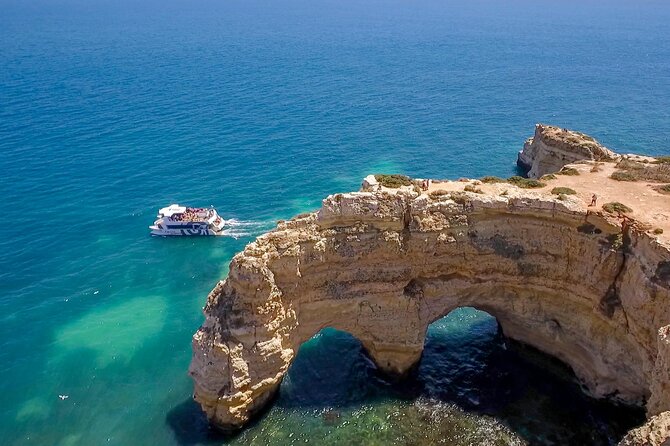 Albufeira Beach BBQ with Caves and Coastline Cruise with Open Bar - Reaching the secluded beach by swim or small boat