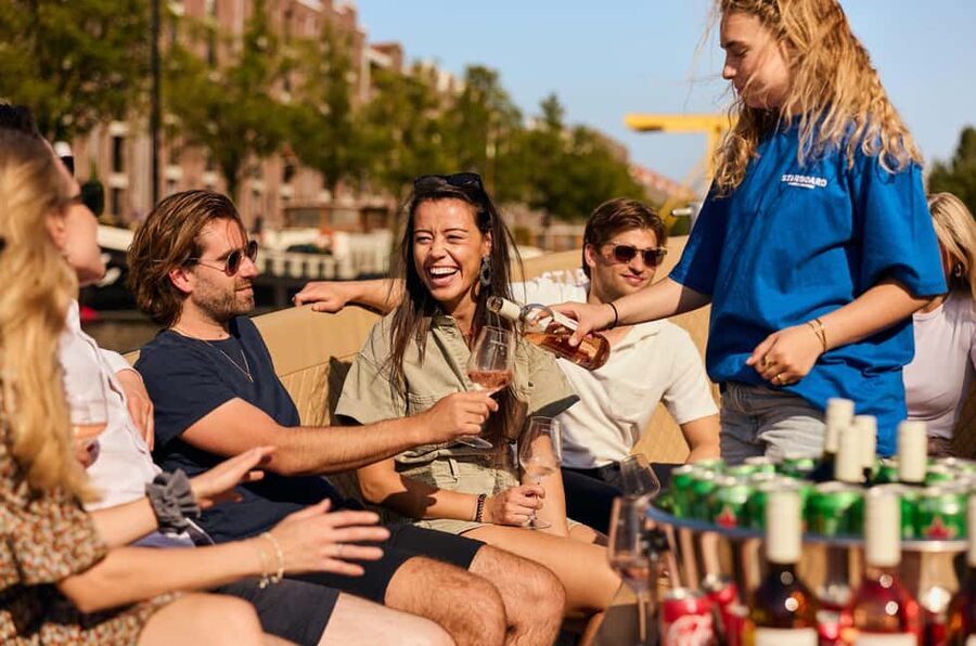 Amsterdam: Cozy Evening Canal Cruise With Open Bar Option - Starting near the old city and the Red Light District