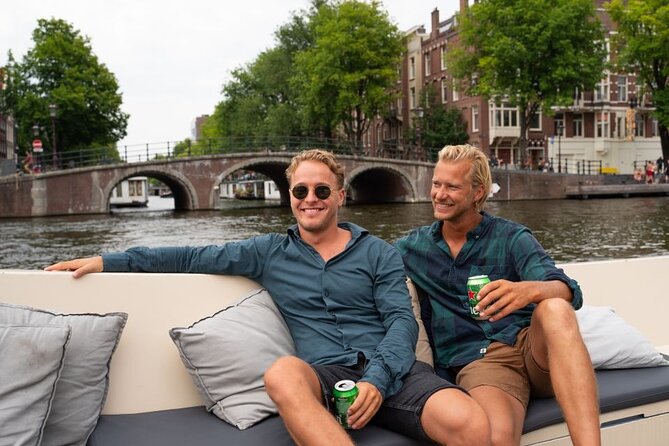 Amsterdam: Evening Candle Light Cruise With Wine & Cheese - Damrak’s Dancing Houses and the grand canal belt
