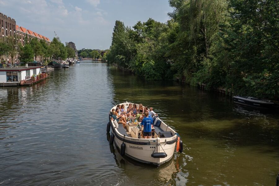 Amsterdam: German Guided Canal Cruise with on Board Bar - Basilica of Saint Nicholas and the city’s religious skyline