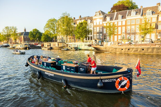 Amsterdam: Guided Open Boat Canal Cruise Unlimited Drinks Option - The Amstel, Waterlooplein, and theater row