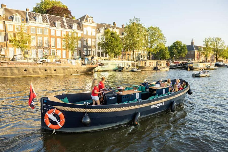 Amsterdam: Guided Open Boat Cruise Unlimited Drinks Option - Setting out beside Amsterdam Centraal Station
