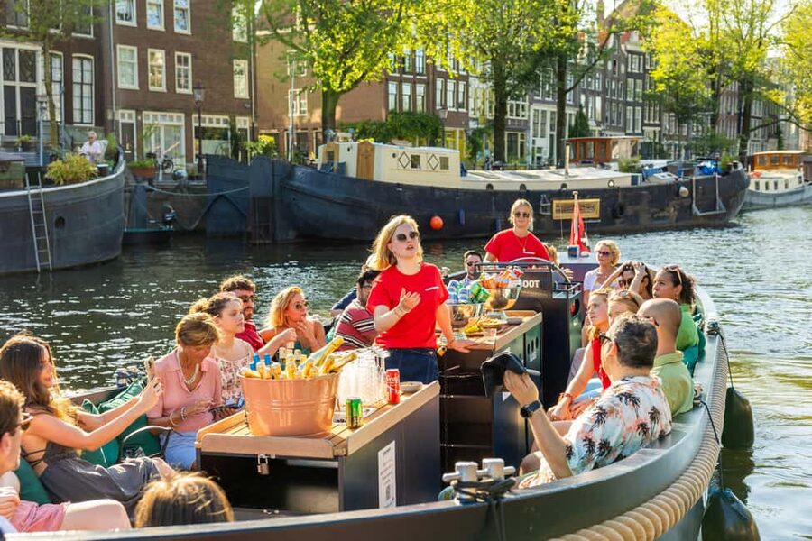 Amsterdam: Guided Open Boat Cruise Unlimited Drinks Option - The Amstel and the famous Skinny Bridge
