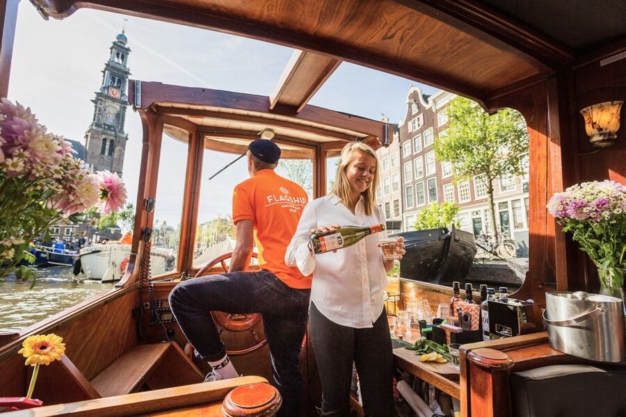 Amsterdam: Heated Canal Cruise with Unlimited Drinks & Bite - Open air, covered, or enclosed depending on weather