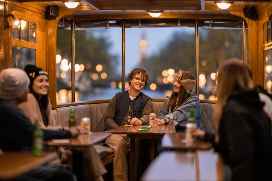 Amsterdam: Heated Canal Cruise with Unlimited Drinks & Bite - Setting out on the electric boat