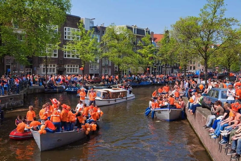 Amsterdam: Kings Day Boat Party with Unlimited Drinks - Boarding a party boat in the middle of Amsterdam