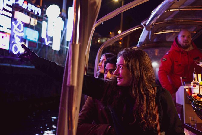 Amsterdam Light Festival: Canal Cruise + Bite & Unlimited Drinks - Open boat or covered boat, depending on the forecast