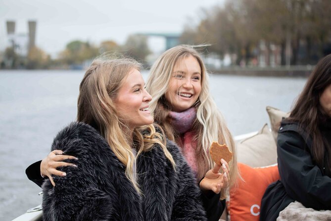 Amsterdam: Luxury Saloon Boat Cruise with Cocktails & Waffle - Skinny Bridge and the final city views