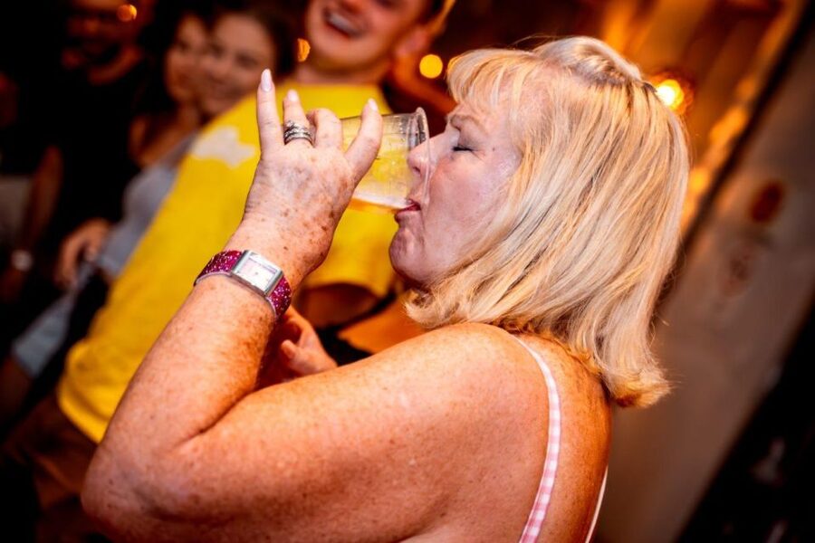 Amsterdam: Original Pub Crawl Party with VIP Entrance - Walking through Amsterdam after dark