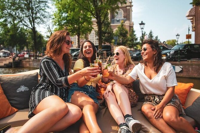 Amsterdam Private Boat Tour with Unlimited Drinks - NEMO, Montelbaanstoren, and Oude Kerk