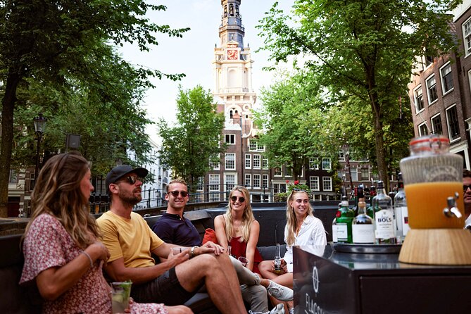Amsterdam Private Boat Trip with Pizza and Unlimited Drinks - Bridges, flower stalls, and Amsterdam’s old center