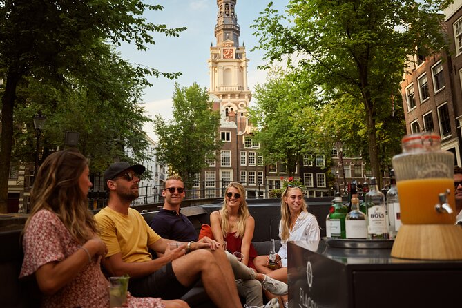 Amsterdam: Saloon Boat Cruise + Unlimited Drinks & Bite option - Zuiderkerk tower and Amsterdam’s old skyline