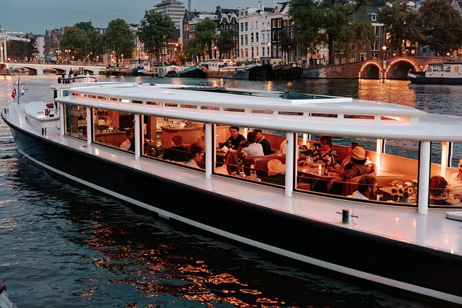 Amsterdam Small-Group Evening Canal Cruise Including Wine, Craft Beer, Cheese - Boarding a small boat instead of a large sightseeing vessel