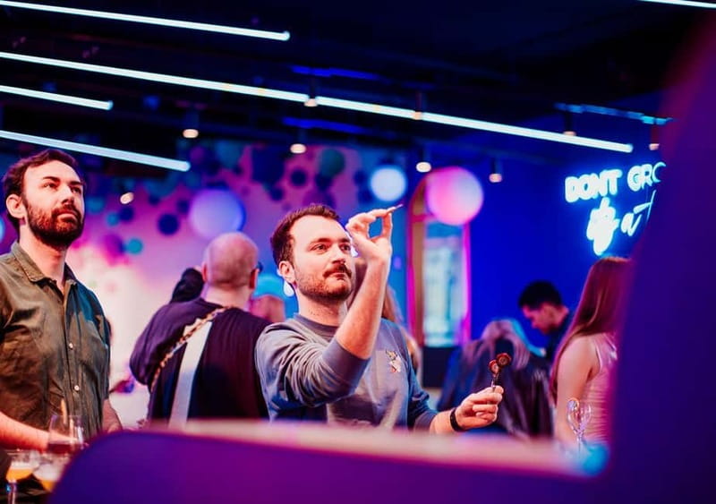 Amsterdam: The All Out - No.1 Activity Bar - Choosing between darts, karaoke, and shuffleboard