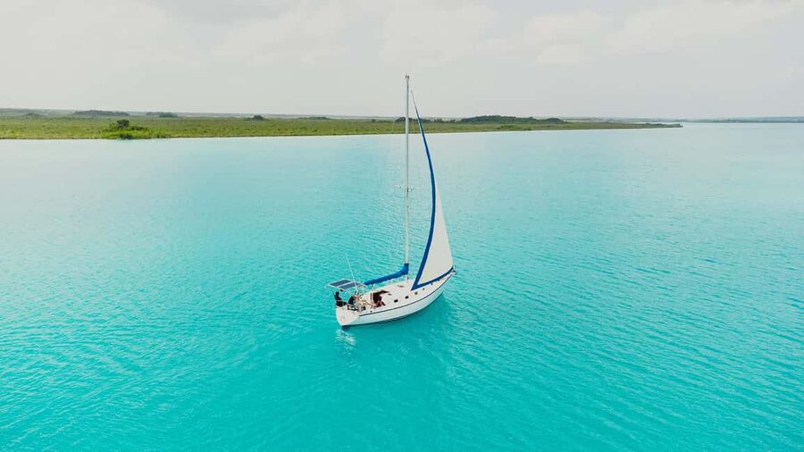 Bacalar Lagoon Sailing Tour with Open Bar and Mexican Lunch - Swimming in clear turquoise water