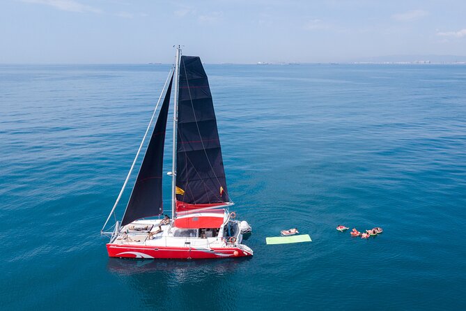 Barcelona Catamaran Cruise with Tapa & Drink Included - Sunset sailing, soft light, and a quieter mood