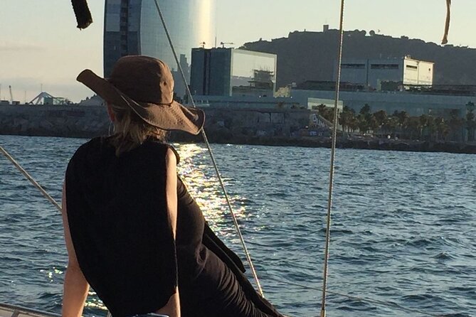 Barcelona: Mediterranean Sailing Experience with Open Bar - Taking the helm and helping with the sails