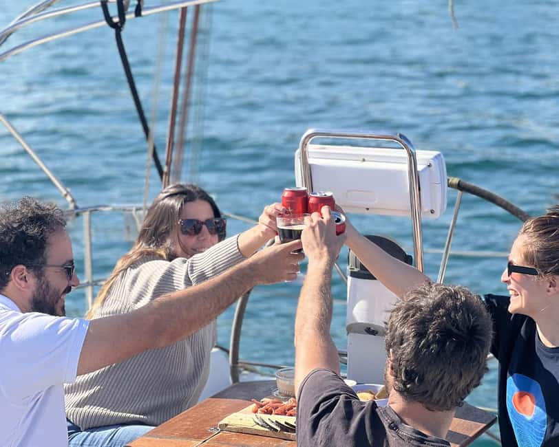 Barcelona: Sailing with Open Bar, Catalan Snack & Swim Stop - The first hour: Barcelona from the Mediterranean