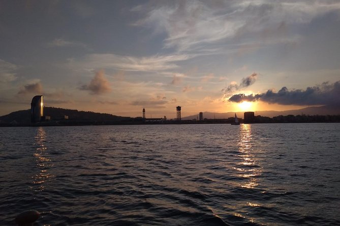 Barcelona Sunset Cruise with Light Snacks and Open Bar - Sailing past Barcelona’s historic waterfront