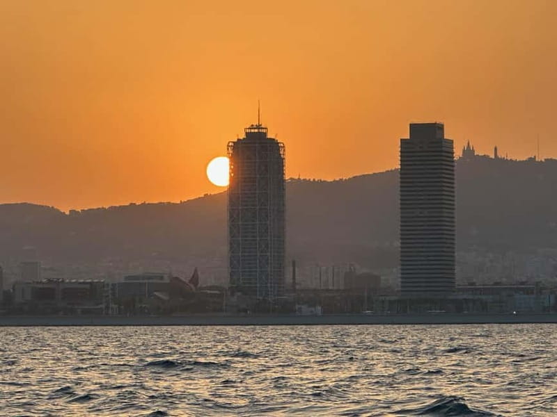 Barcelona: Sunset Sailboat Cruise with Open Bar and Snacks - What the skyline looks like at sunset