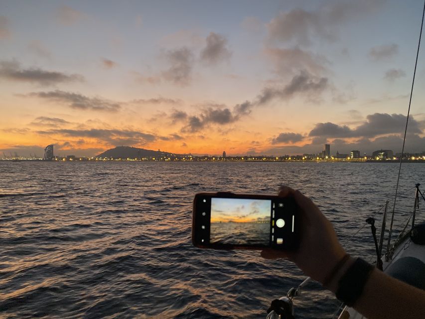 Barcelona: Sunset Sailing Tour with Open Bar & Snacks - The swimming stop depends on the sea