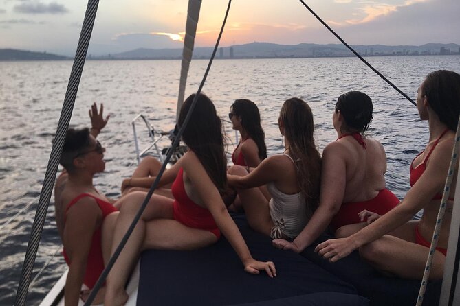 Barcelona Sunset Sailing with Open Bar of Cava and Snacks - Captains and the mood on board