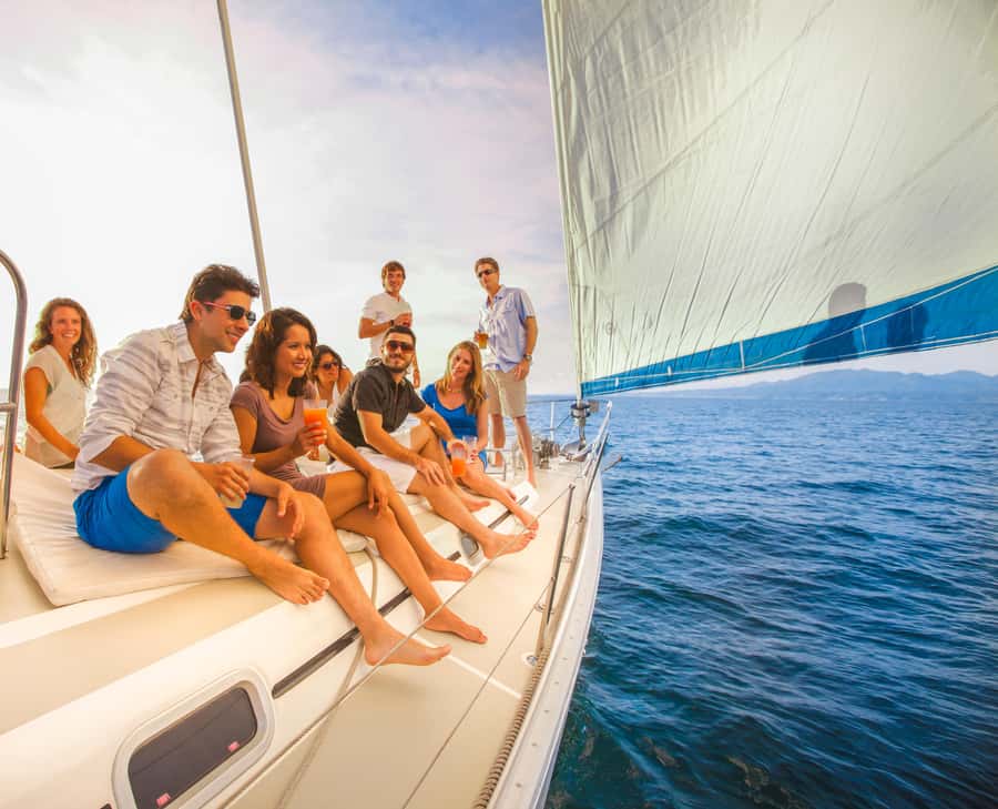 Cabo Luxury Sunset Sailing Adventure with Open Bar - Sailing past El Arco and Lovers Beach after dark