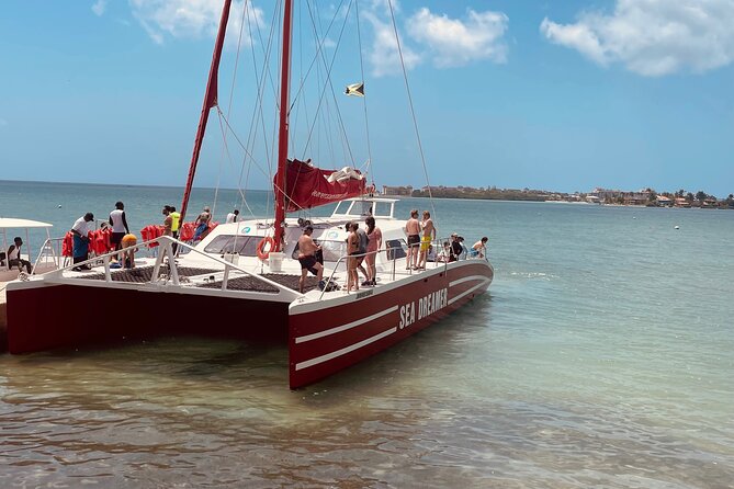 Catamaran Party Cruise and Snorkeling in Montego Bay - Reaching the boat from Bogue Road