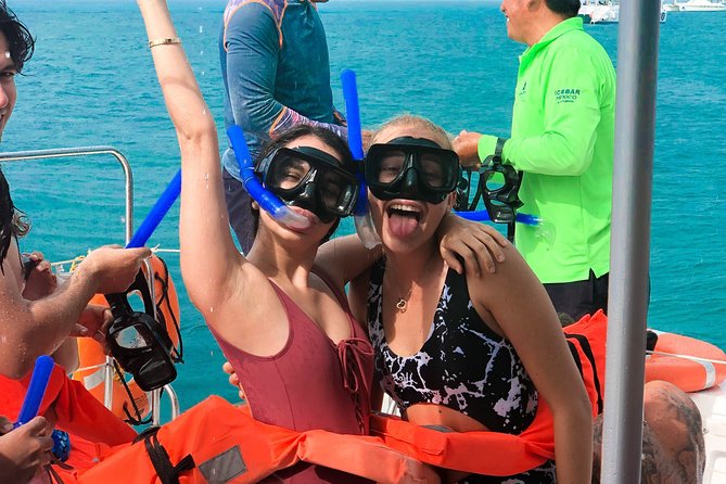 Catamaran Sailing to Isla Mujeres with Snorkeling, Lunch & Open Bar included - Lunch and beach-club time on Isla Mujeres