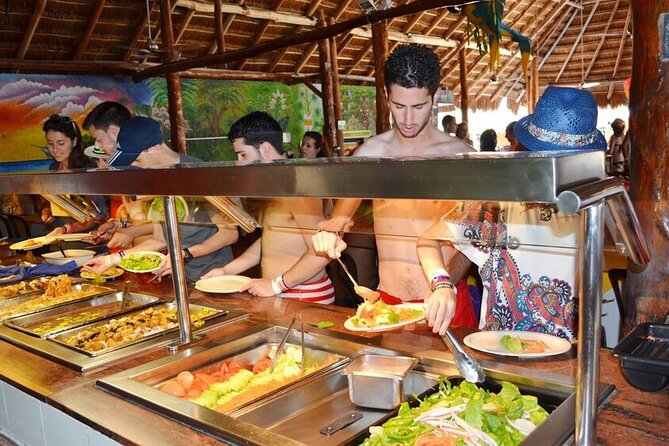 Catamaran Tour to Isla Mujeres from Cancún with Bar and Lunch - Beach-club time on Isla Mujeres