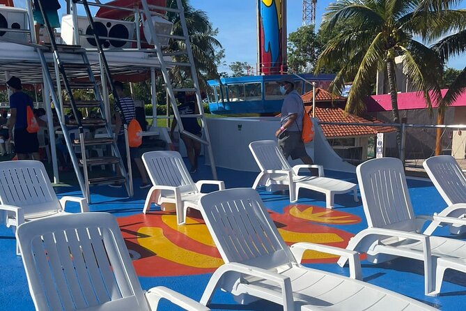Dancer Cruise Isla Mujeres Snorkel Food and Drinks Included - The slide, trampoline, and ocean swim