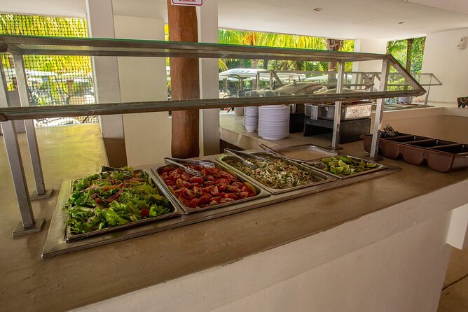 Deluxe Catamaran tour to Isla Mujeres with Open Bar and Lunch - Snorkeling at El Meco Reef