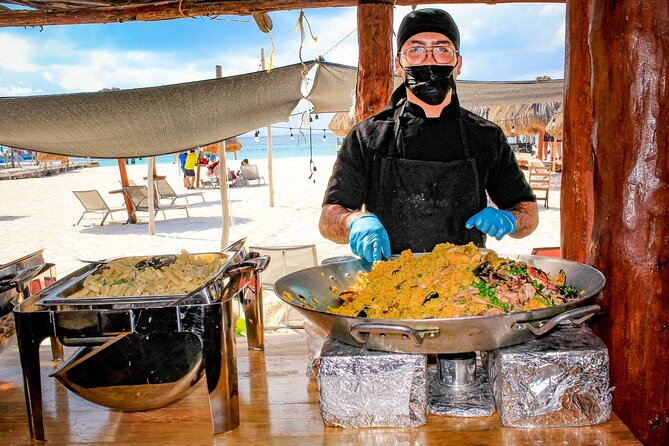 Discover Isla Mujeres: Catamaran, Snorkeling, and "Ice Bar" - Catamaran cruising with drinks and music