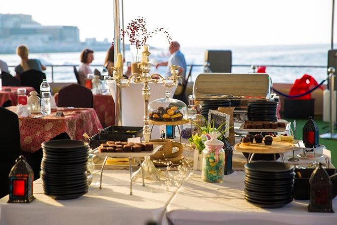 Dubai Marina Dinner Cruise with Live Music & Open Bar - Sailing Through Dubai Marina at Sunset