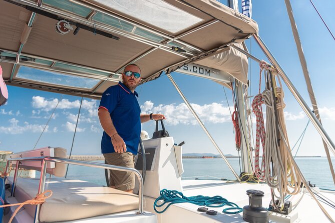 Hersonissos: Luxury Sunset Catamaran Cruise Sushi & Open Bar - Agios Georgios Sarantaris: cliffs, chapel, and a swim stop