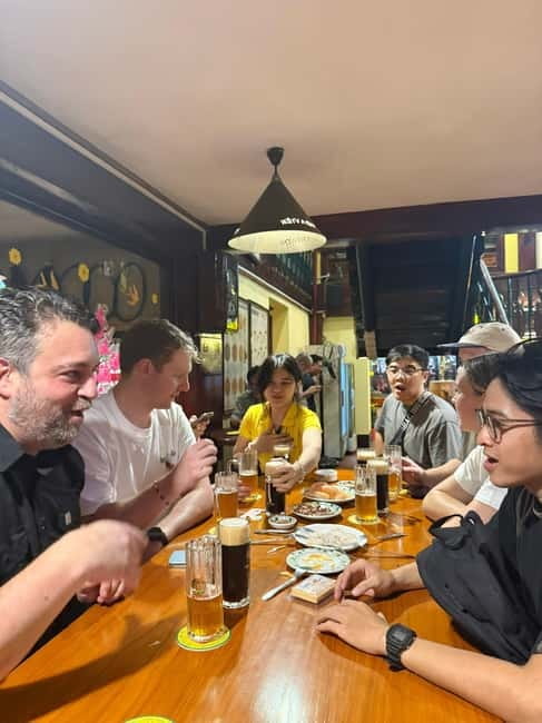 Ho Chi Minh City: Craft Beer and Local Food Tour by Scooter - Five food stops that carry the evening