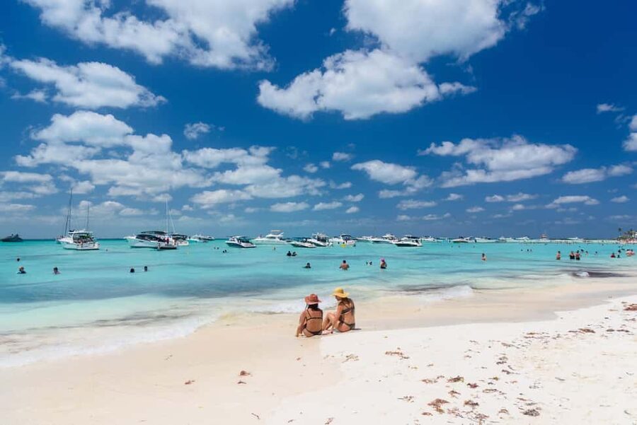 Isla Mujeres: Catamaran Ride with Open Bar, Snorkeling, and Lunch - Leaving Cancun on a social catamaran