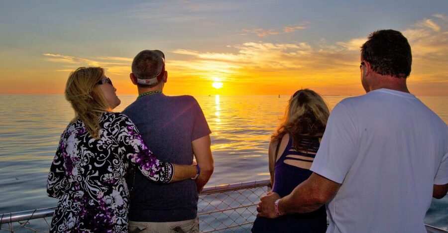 Key West Signature Sunset Cruise with Open Bar, Food & Music - Raising the sails on the Sandie Cat