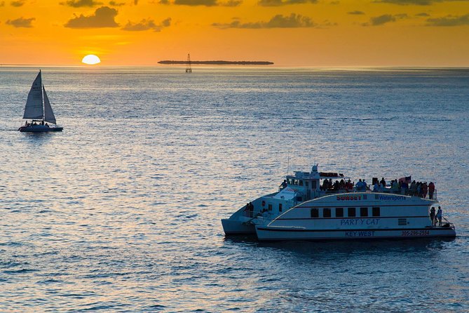 Key West Sunset Cruise: Dinner, Live Music & Drinks Included - Watching the sunset near Mallory Square