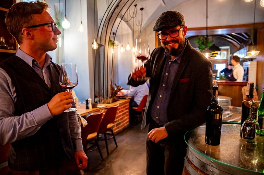 Krakow: Guided Wine Bar Tour with Tastings and Snacks - Walking through Old Town between tastings