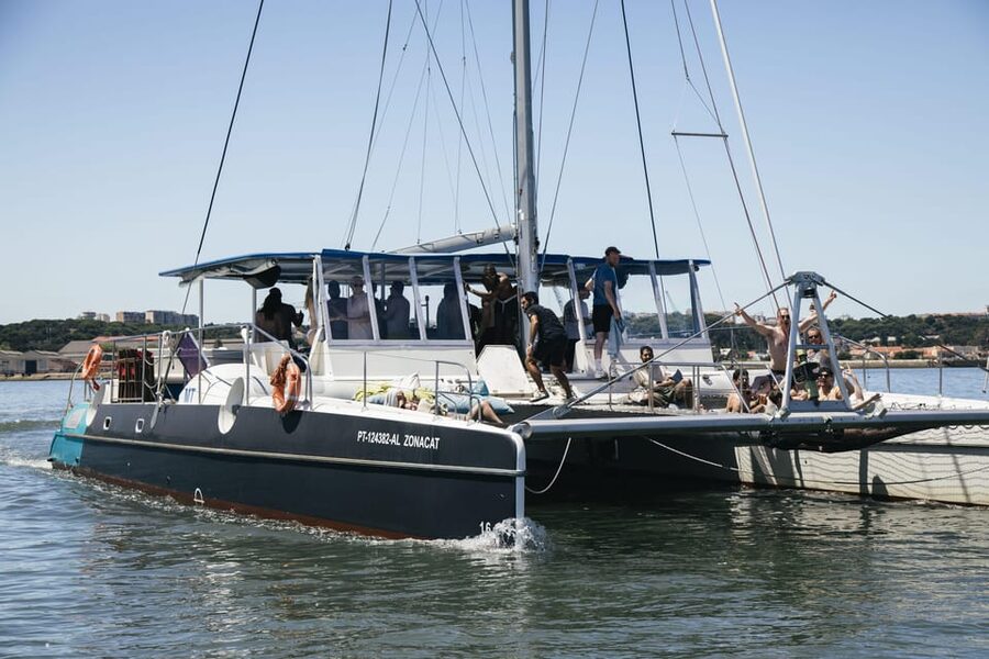 Lisbon: Catamaran Boat Party with Music, Open Bar & Dives - Starting at Doca de Santo Amaro