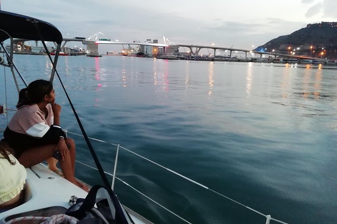 Luxury Private Sunset Cruise in Barcelona – Open Bar Included - Passing Maremagnum on the pontoons