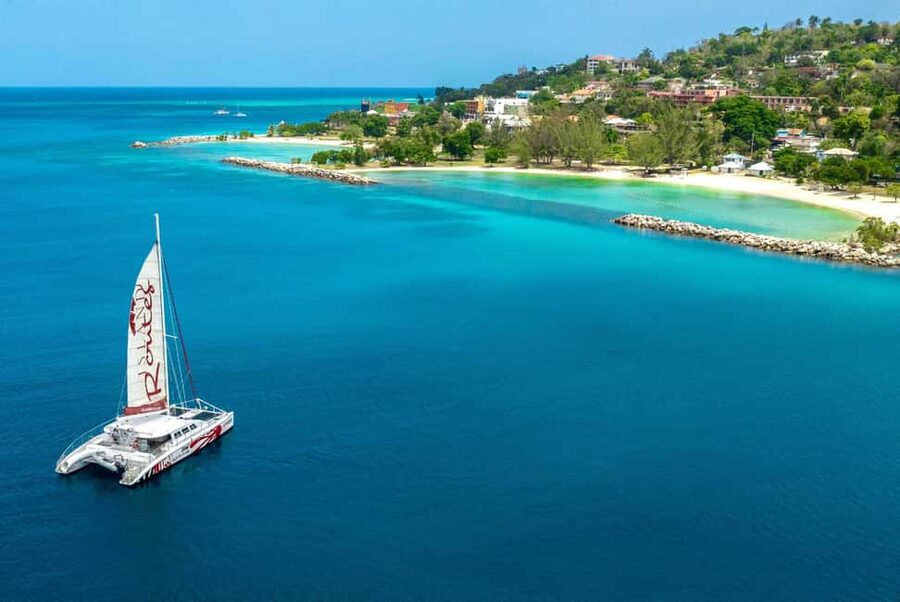 Montego Bay: Reggae Catamaran 18+ Cruise with Open Bar - A short snorkeling stop with clear water