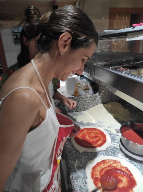 Naples: Small Group Pizza Making with Drink Included - Watching the pizzaiolo finish the pizza