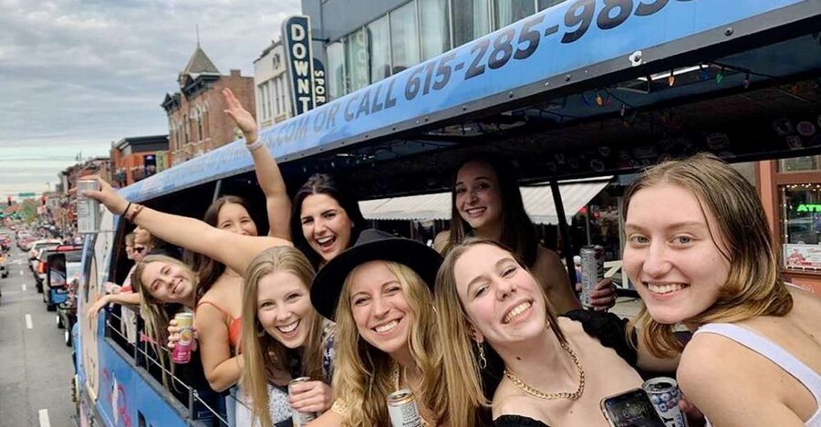 Nashville: Party Bus with DJ and Bar - The blue Tin Roof bus and pink Big Machine bus
