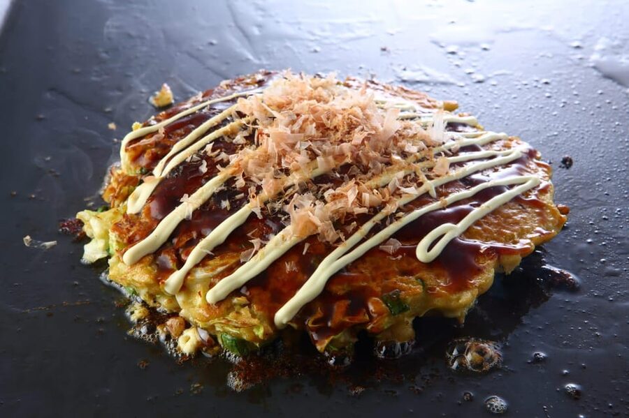 Osaka: Cooking Class & Sake Tasting with Local Market Visit - Folding gyoza turns lunch into a group activity