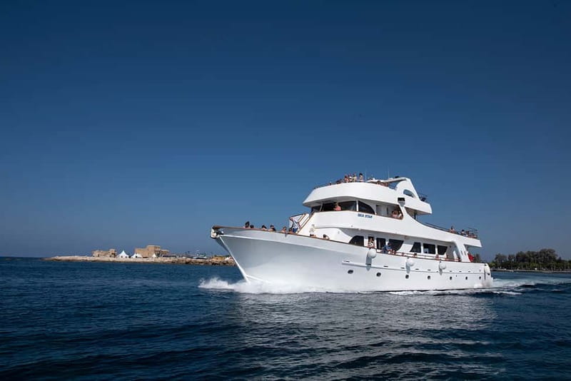 Paphos: Half Day BBQ Cruise with Open Bar & Snorkelling - Cruising past Coral Bay