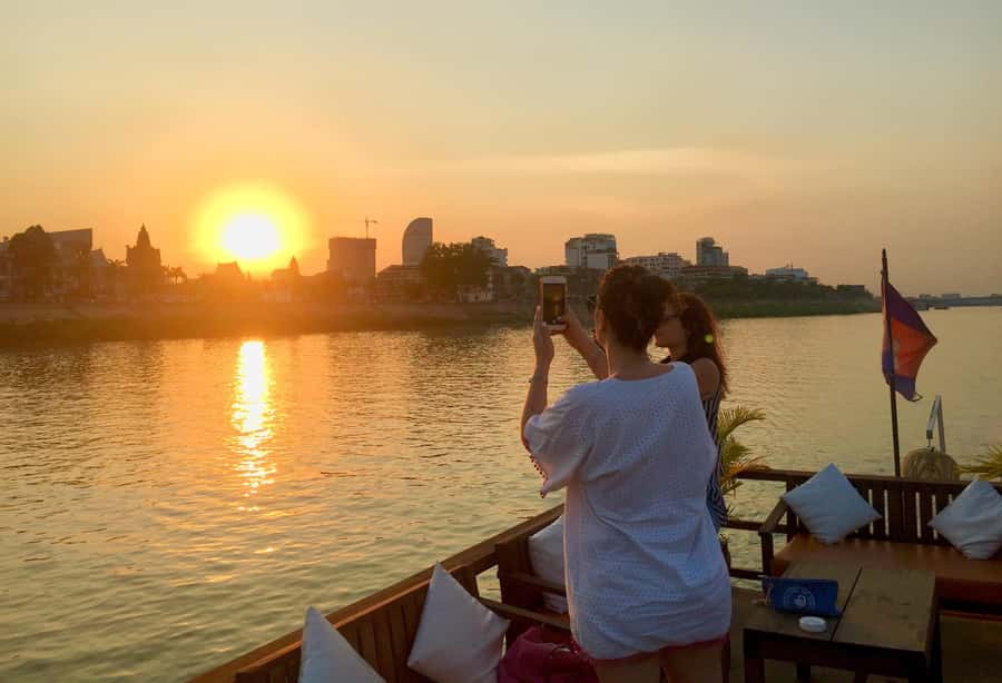 Phnom Penh: Sunset Cruise with Unlimited Beer &Fruit platter - Drinks, fruit, and the change from commentary to sunset