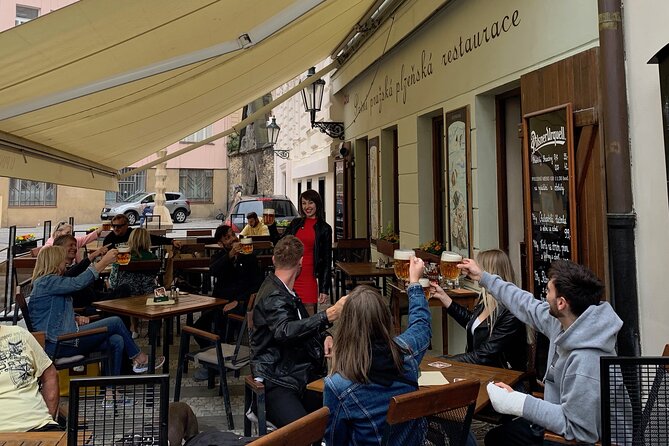 Prague Historic Pub Tour with Drinks Included - The social side: games, photos, and guide style