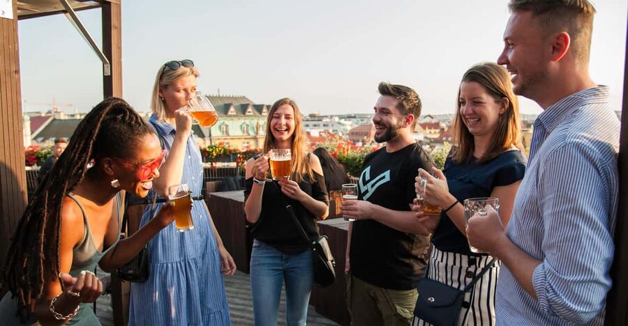 Prague: Local Pub Walking Tour with 5 Beers - Meeting the guide beneath Kafka’s silver head